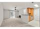 Living room with fireplace, built-in shelving, and access to a patio at 534 Granville Ct, Atlanta, GA 30328