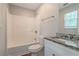 Bathroom with granite countertop vanity and shower/tub combo at 7133 Pineview Sw Dr, Covington, GA 30014