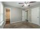 Bedroom with private bathroom access and double closets at 7133 Pineview Sw Dr, Covington, GA 30014