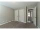 Bedroom with double closets and access to another bedroom at 7133 Pineview Sw Dr, Covington, GA 30014
