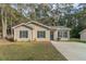 Newly built home with gray siding, gray shutters, and a gray door at 7133 Pineview Sw Dr, Covington, GA 30014