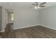 Open living space with gray walls, wood-look floors, and access to other rooms at 7133 Pineview Sw Dr, Covington, GA 30014