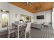 Spacious covered porch with outdoor furniture and ceiling fan at 1782 Patrick Rd, Dacula, GA 30019