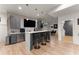 Gray cabinetry, white countertop, and brick backsplash in this basement bar at 1782 Patrick Rd, Dacula, GA 30019