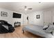 Basement bedroom with a massage chair and flat-screen TV at 1782 Patrick Rd, Dacula, GA 30019