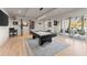 Basement game room featuring a pool table and access to a patio at 1782 Patrick Rd, Dacula, GA 30019