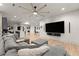 Spacious basement with sectional sofa, large TV, and wet bar at 1782 Patrick Rd, Dacula, GA 30019