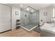Spa-like bathroom with a large glass shower, marble tile, and modern vanity at 1782 Patrick Rd, Dacula, GA 30019