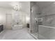 Luxurious bathroom with soaking tub, large shower, and marble floors at 1782 Patrick Rd, Dacula, GA 30019