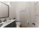 Modern bathroom with gray vanity and white toilet at 1782 Patrick Rd, Dacula, GA 30019
