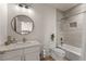 Clean bathroom with a tub, toilet and updated vanity at 1782 Patrick Rd, Dacula, GA 30019