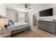 Bright bedroom with a comfortable bed and built-in TV at 1782 Patrick Rd, Dacula, GA 30019