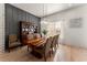 Sunlit dining room with hardwood floors, a wood table, and charming decor at 1782 Patrick Rd, Dacula, GA 30019