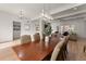 Open dining room with hardwood floors, large table, and view into living room at 1782 Patrick Rd, Dacula, GA 30019