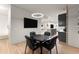 Basement game room with a round table, chairs, and a bar area at 1782 Patrick Rd, Dacula, GA 30019