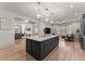 Open kitchen boasts a large island, stainless steel appliances, and ample counter space at 1782 Patrick Rd, Dacula, GA 30019
