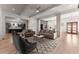 Open living room with hardwood floors, neutral decor, and view of kitchen at 1782 Patrick Rd, Dacula, GA 30019