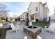 Relaxing backyard oasis with a pool, fire pit, and patio furniture at 1782 Patrick Rd, Dacula, GA 30019