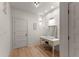 A bright vanity area with a dressing table and mirror at 1782 Patrick Rd, Dacula, GA 30019