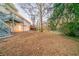 Grassy backyard featuring a two-story home with a deck at 3401 Tulip Dr, Decatur, GA 30032