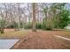 Spacious backyard with mature trees and lawn at 3401 Tulip Dr, Decatur, GA 30032