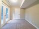 Basement featuring neutral walls and carpet, plus walkout to the outdoors at 3401 Tulip Dr, Decatur, GA 30032