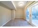 Basement features neutral walls and carpet, with walkout to the outdoors at 3401 Tulip Dr, Decatur, GA 30032