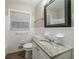 A full bathroom with a granite countertop and a window at 3401 Tulip Dr, Decatur, GA 30032
