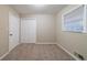 Neutral bedroom features plush carpet, a double door closet, and natural light from window at 3401 Tulip Dr, Decatur, GA 30032