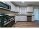 Modern kitchen with stainless steel appliances and ample cabinet space at 3401 Tulip Dr, Decatur, GA 30032