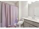 Clean bathroom with a shower/tub combo and gray vanity at 5857 Silver Lake Dr, Mableton, GA 30126