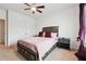 Spacious bedroom with a queen-size bed and double doors at 5857 Silver Lake Dr, Mableton, GA 30126