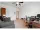 Spacious home office with a desk, couch, and ample natural light at 5857 Silver Lake Dr, Mableton, GA 30126