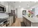 Modern kitchen with gray cabinets, granite counters and island at 5857 Silver Lake Dr, Mableton, GA 30126
