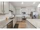 Modern kitchen with gray cabinets, granite countertops and stainless steel appliances at 5857 Silver Lake Dr, Mableton, GA 30126