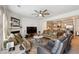 Open living room with kitchen view, ceiling fan and comfortable seating at 5857 Silver Lake Dr, Mableton, GA 30126