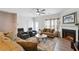 Living room with fireplace, ceiling fan and comfortable seating at 5857 Silver Lake Dr, Mableton, GA 30126