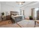 Relaxing main bedroom with a king-size bed and ceiling fan at 5857 Silver Lake Dr, Mableton, GA 30126