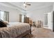 Large main bedroom with king bed, dresser, and access to bath at 5857 Silver Lake Dr, Mableton, GA 30126