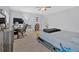 Main bedroom with a workspace, large bed, and access to a private bathroom at 1010 Bergeron Pl, Sandy Springs, GA 30328