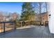 Spacious back deck with dark stained wood and metal railings, overlooking a backyard at 4100 Devon Wood Ne Dr, Marietta, GA 30066