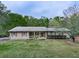 Ranch style home with red shutters and spacious lawn at 4445 Moon Station Nw Ln, Acworth, GA 30101