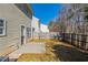 View of backyard with partial fencing and a small patio area at 128 Prity Ct, Mcdonough, GA 30253