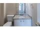 Bathroom featuring a granite-look vanity with white cabinetry and brushed nickel fixtures at 128 Prity Ct, Mcdonough, GA 30253