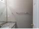 Bathroom featuring a granite-look vanity, brushed nickel fixtures, and a large mirror at 128 Prity Ct, Mcdonough, GA 30253