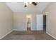 Bedroom with carpet, ceiling fan, and a view into the bathroom at 128 Prity Ct, Mcdonough, GA 30253