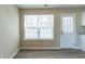 Dining area with large windows and a door leading to the exterior of the home at 128 Prity Ct, Mcdonough, GA 30253
