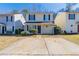 Charming two-story home featuring a quaint front porch and a spacious two-car driveway at 128 Prity Ct, Mcdonough, GA 30253
