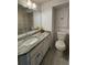 Elegant bathroom with a granite countertop vanity, modern fixtures, and ample storage space at 5 Belmonte Sw Ct, Atlanta, GA 30311