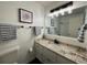 This beautiful bathroom features granite counters at 5 Belmonte Sw Ct, Atlanta, GA 30311